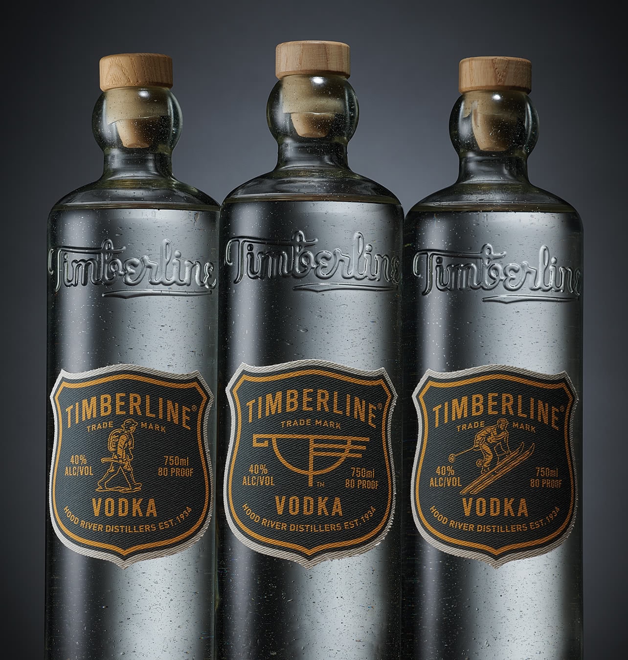 Timberline Vodka group of bottles with three differrent canvas label designs
