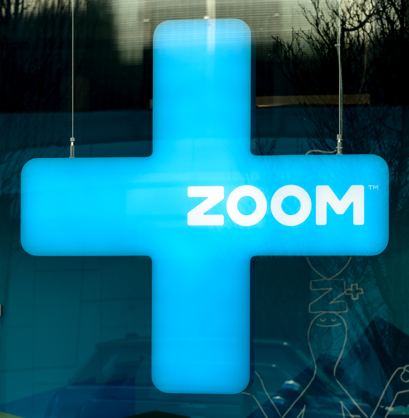 Zoom+ identity window signage design
