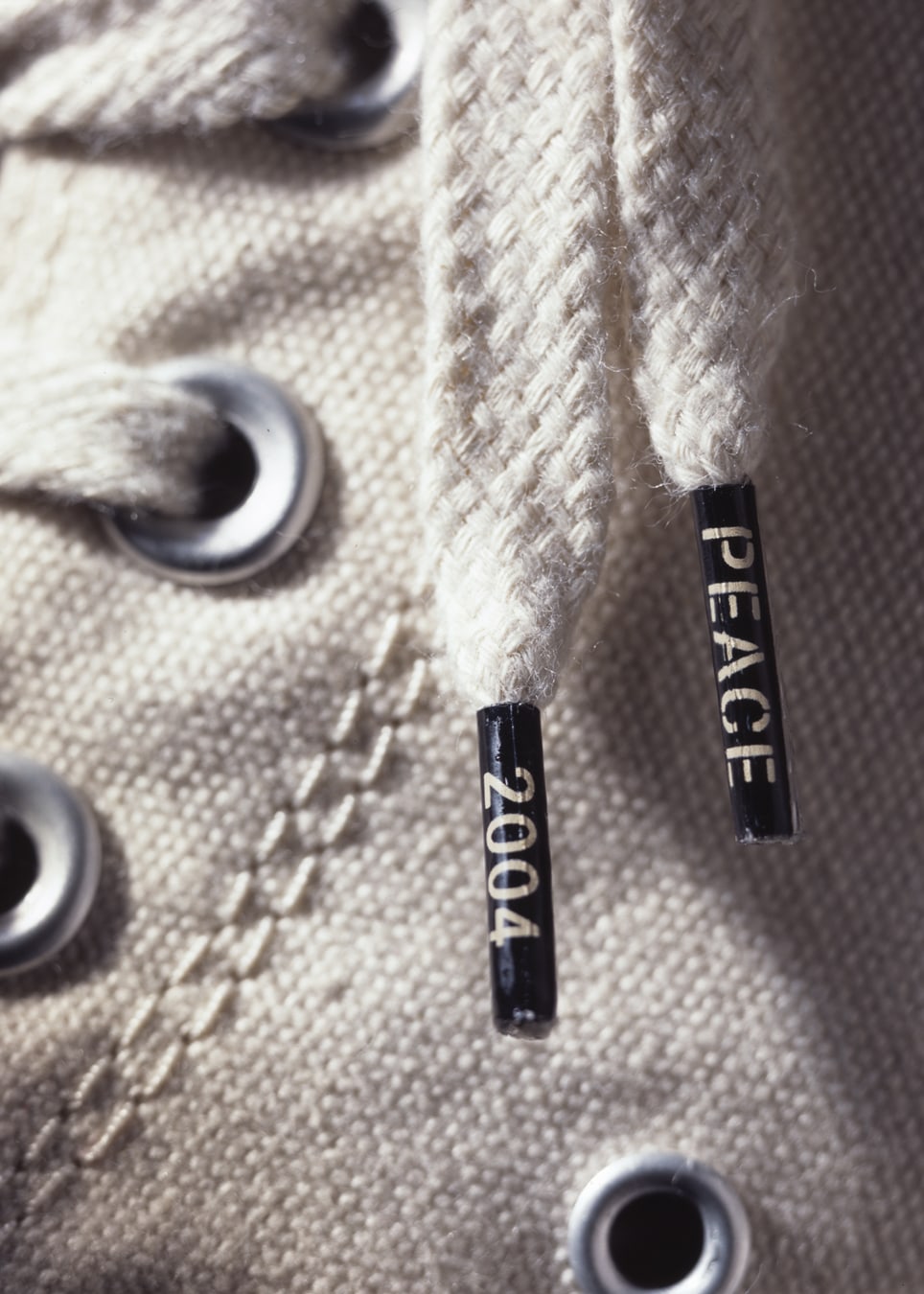Converse Chuck Taylor Peace Shoe lace aglet detail