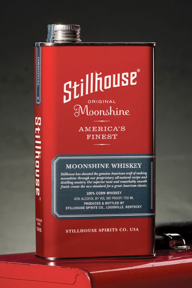 Stillhouse Original Moonshine screwtop stainless steel can displayed on top of a shiny red tool box.